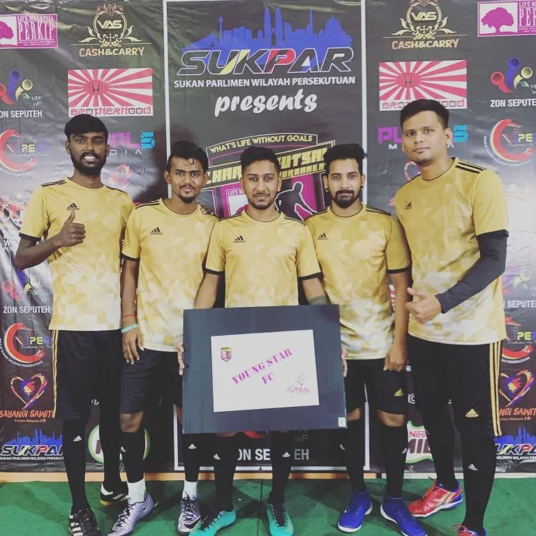 Team in gold jerseys at the 2019 charity futsal