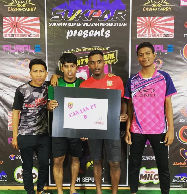 Players with their team placard at the 2019 charity futsal
