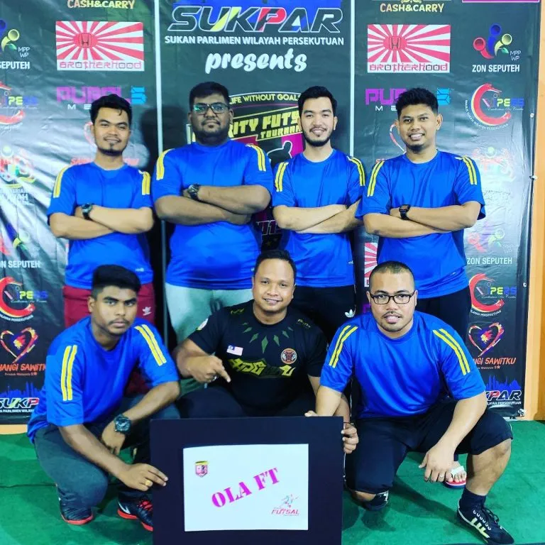 Team in blue jerseys at the 2019 charity futsal