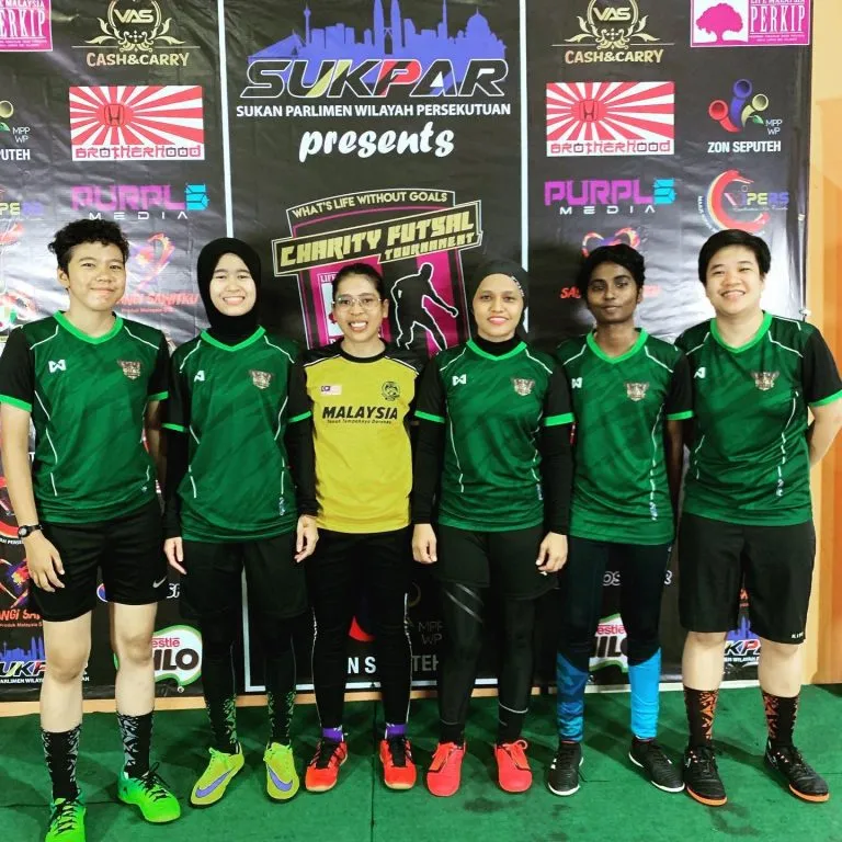 Women's team in green jerseys at the 2019 charity futsal